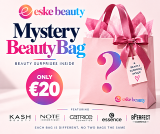 Promotional graphic for an Eske Beauty Mystery Beauty Bag, showing a pink gift bag with a large question mark, pink satin ribbon, and a hanging tag that reads 'A BEAUTY SURPRISE INSIDE.' The image includes pricing text ('ONLY €20'), featured brands at the bottom, and a clean light pink background.
